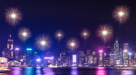 Wall Mural - Firework over cityscape building near sea at night time celebration event