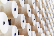 Large Group Of Bobbin Thread Cones On A Warping Machine In A Textile Mill.