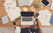 © Prostock-studio - African-american businessman at work, table top view