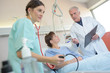 © auremar - Nurse taking patient's blood pressure