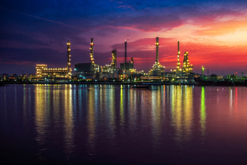 Wall Mural - Oil and gas industry - refinery at Sunrise - factory - petrochemical plant with reflection over the river