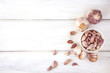 Close up group of garlic on white wooden table board , top view or overhead shot with copy space