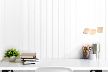 loft workspace concept. mock up white table and books, minimal stuff on desk. copy space for product