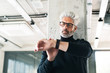 © Halfpoint - Mature businessman with gray hair in the office.