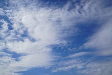 Wall Mural - scene of wind blow free form white cloud as per imagination on bright blue sky background