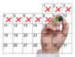 © beebright - Hand marking a single day with a green checkmark after severeal bad days
