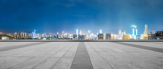 empty floor with cityscape of hangzhou in blue cloud sky at twilight