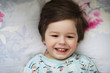 © alexkich - Portrait of a young child lying on a pillow
