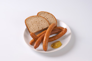 Wall Mural - long thin sausages with bread