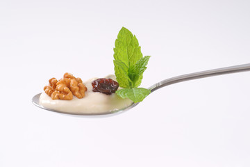 Canvas Print - spoon of cream cheese with nuts and raisins