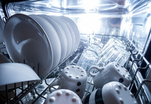 Interior Of Dishwasher Machine With Clean Dishes
