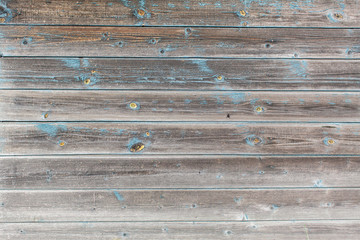 Peeling paint on old wooden rustic material on the wall. Wood texture backgrounds.