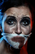 © tugolukof - woman with wounded face and smeared cosmetics looking at camera