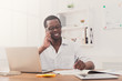 © Prostock-studio - Young black businessman call mobile phone in modern white office