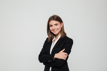 portrait of smiling young businesswoman in suit