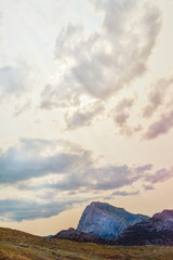 Wall Mural - beautiful landscape with green mountains and magnificent cloudy sky in sunset. exploring crimea, sud