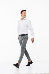 Sticker - Full length portrait of a happy smiling man in a white shirt