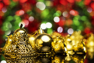 Wall Mural - Christmas decoration on a golden background. bokeh background and dark mirror floor.