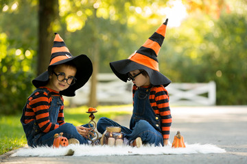 Canvas Print - Two boys in the park with Halloween costumes, having fun