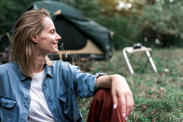 Wall Mural - Positive female tourist enjoying landscape in forest