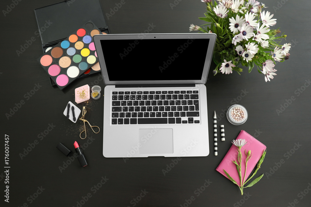 Comfortable workplace of beauty blogger with modern laptop on table
