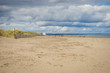 People walking West Sands beach on North Sea, St Andrews