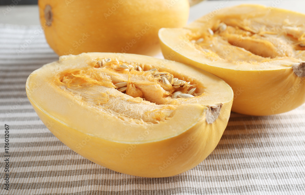 Ripe spaghetti squashes on striped fabric