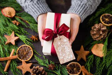 Christmas gift on the antique wooden background.