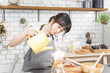 © maroke - young woman making drip coffee