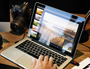 man editing photos on a computer