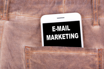 Wall Mural - Email Marketing. Smartphone in jeans pocket. Technology business and communication, advertising background.