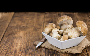 Fresh Porcinis on an old wooden table (close-up shot)