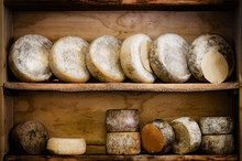 Traditional Italian Hard Cheese From Piedmont On A Wooden Shelf
