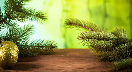christmas fir tree with decoration on wooden board