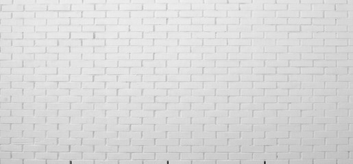  Brick wall painted with white paint.