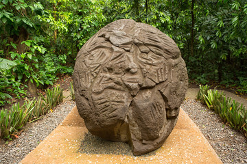 large pre-hispanic olmec basalt carved head in the La Venta archeological park in Villahermosa Mexico