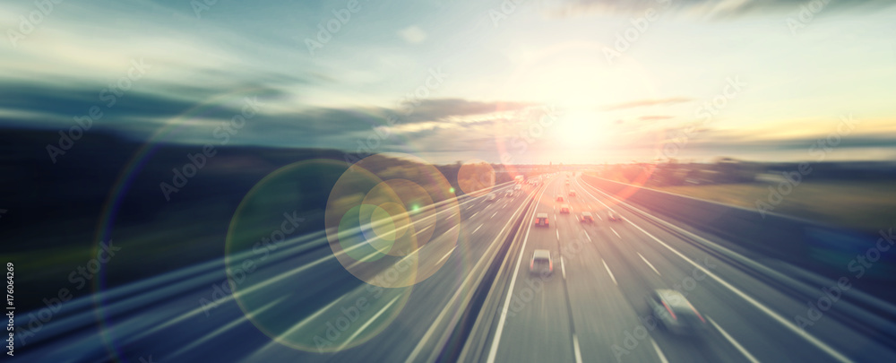 busy highway traffic at sunset time  - obrazy, fototapety, plakaty 