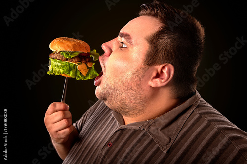 Diet failure of fat man eating fast food. Happy smile overweight person ...