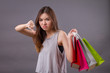 woman shopping with shopping bag and thumb down hand sign, bad shopping experience concept