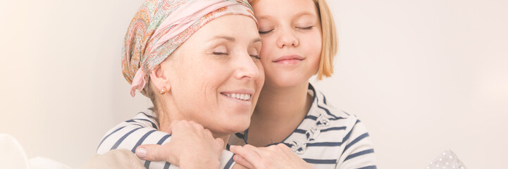 mother supported by daughter
