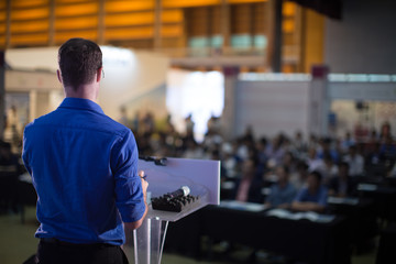 Fototapete - Man Presenting to Audience