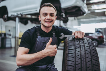 Wall Mural - Handsome auto service mechanic