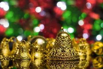 Wall Mural - Christmas decoration on a golden background. bokeh background and dark mirror floor.