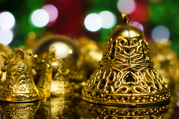 Wall Mural - Christmas decoration on a golden background. bokeh background and dark mirror floor.