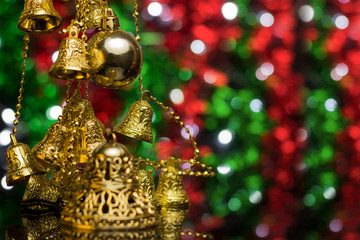 Wall Mural - Christmas decoration on a golden background. bokeh background and dark mirror floor.