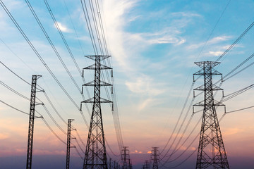 High voltage post.High-voltage tower sky with sun