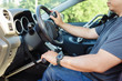 © Preappy/Stocksy - Man with a mobility impairment driving a car equipped with hand controls
