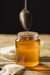 © Wells/Stocksy - a spoon dropping honey