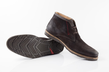 Male brown leather boot on white background, isolated product, comfortable footwear.