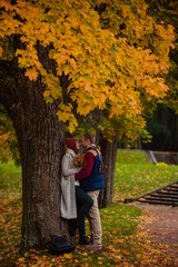 Wall Mural - Beautiful pair of lovers walking in the autumn Park